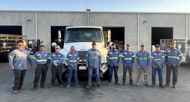 GAR drivers and delivery team standing in front of a company truck