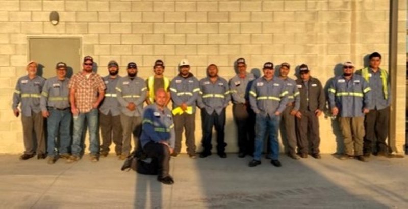 GAR operations and warehouse team standing in front of a company truck